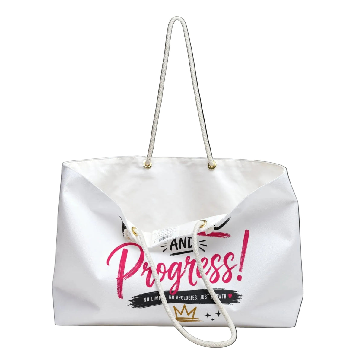 A white canvas tote bag with white rope handles, featuring a graphic print on the front that reads 'AND Progress!' in pink and black, with a small gold crown logo at the bottom.