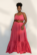 Dark skin plus size Black woman in coral maxi dress with belt