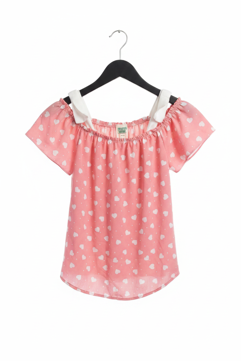 Pink heart print off-shoulder puff sleeve top on white background