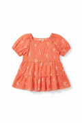 Coral floral tiered puff sleeve top on white background
