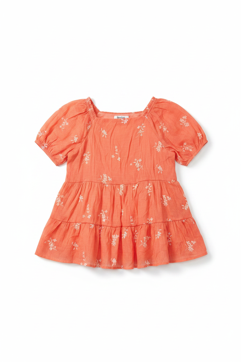 Coral floral tiered puff sleeve top on white background