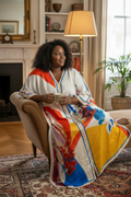 Plus-size Black woman in fully smooth floral kaftan at home