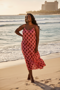 Plus Size Black Woman in Red Diamond Dress at the Beach