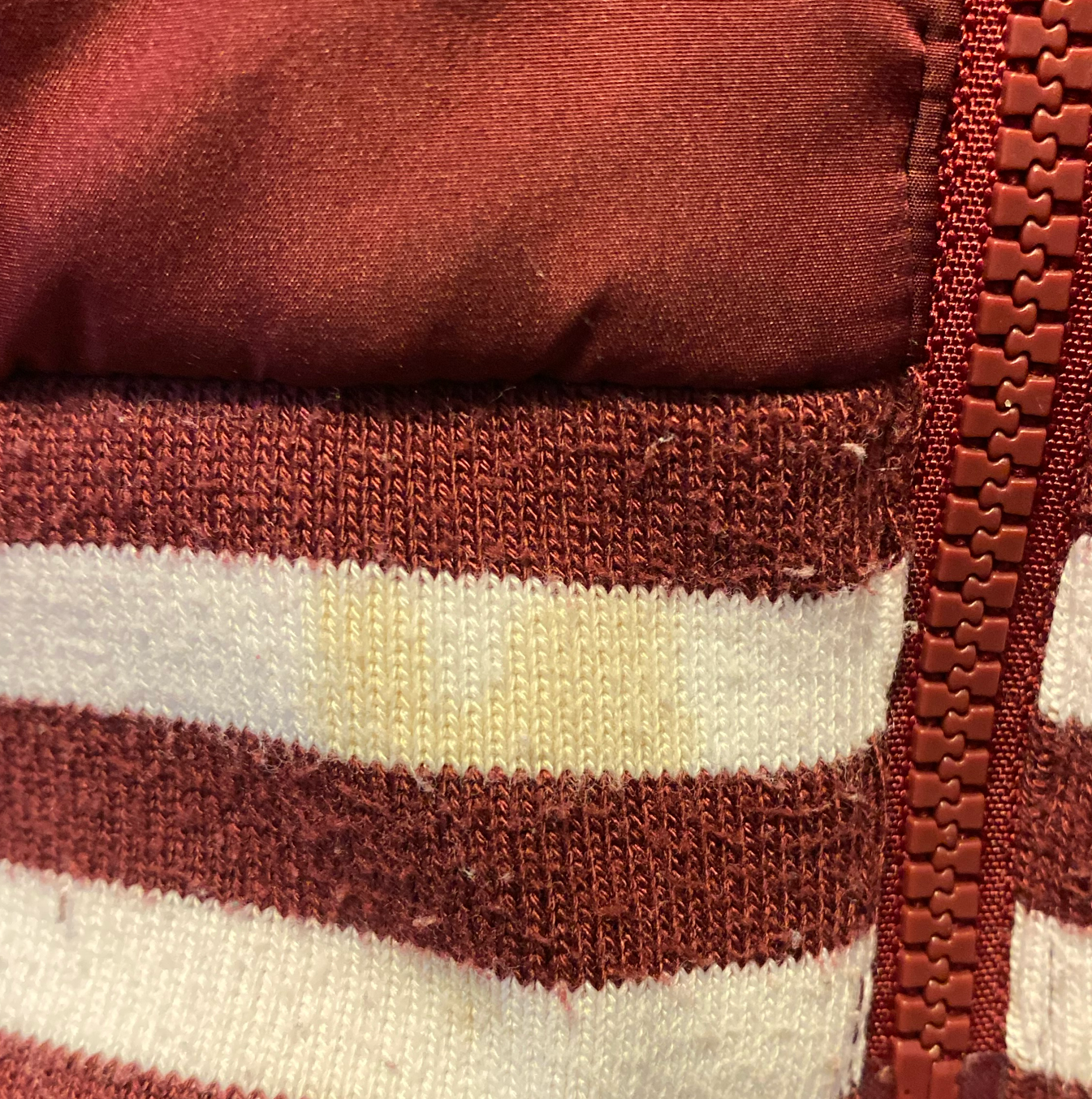 TE&A Treasures burgundy quilted bomber jacket with white striped ribbed cuffs and hem, full zip.