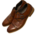 TE&A Treasures men's brown leather monk strap dress shoes with cap toe and silver buckle detail.