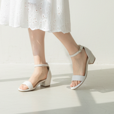 Young Adult Chinese Woman with White Block Heel Sandals
